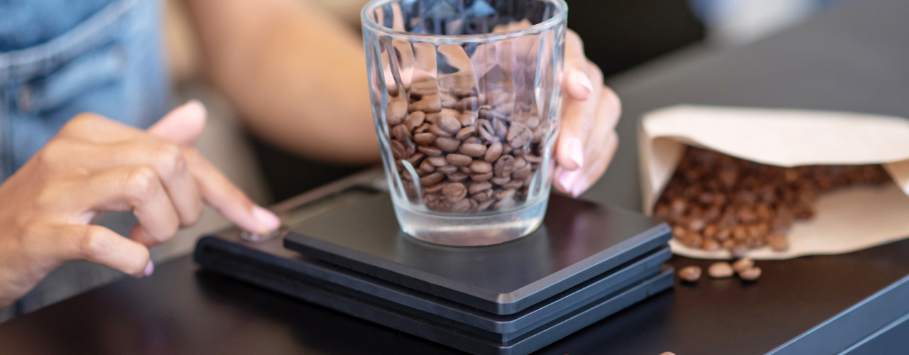 Do you need a scale to make good coffee, fresh coffee beans being weighed with an accurate coffee scale